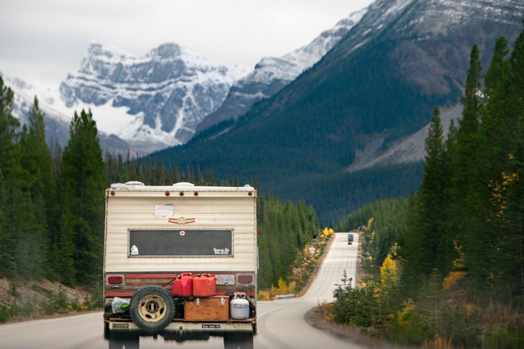 A camper on a mountain road through the pines